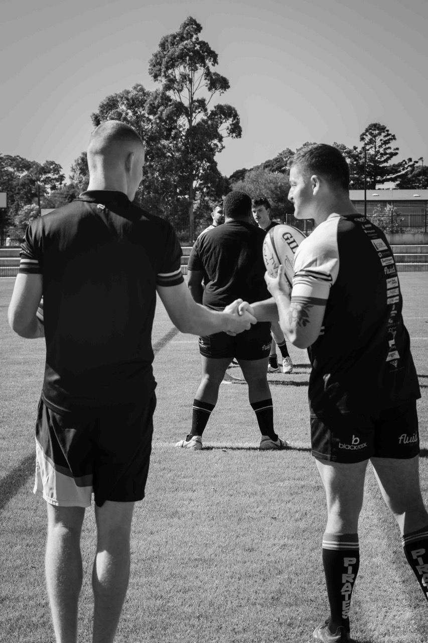 Captains shake hands with the referee before the match