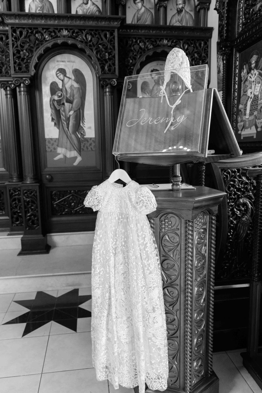A christening gown hanging before the service