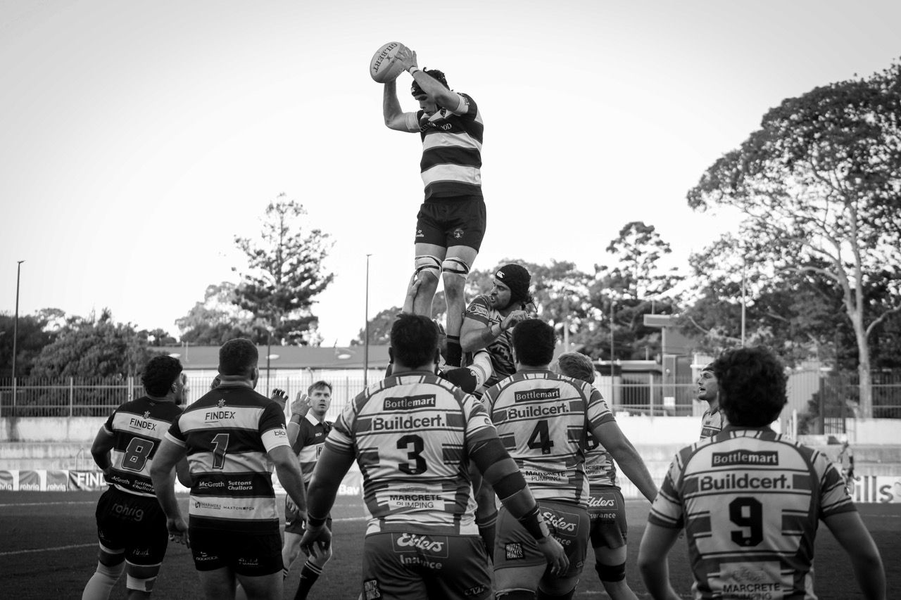 A lineout throw caught above a line of players